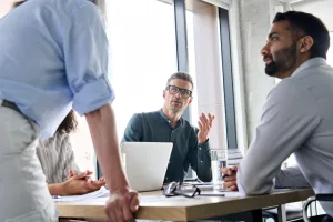 business executive team brainstorming sharing ideas with leader