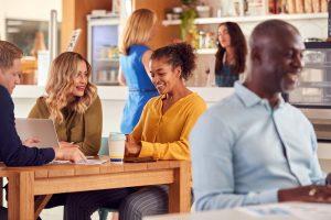 Meeting Around Table In Office Coffee Shop